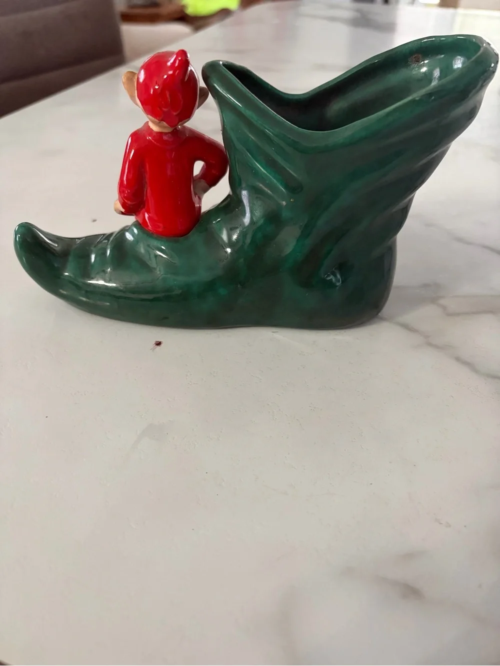 Vintage mid century ceramic pixie elf on a green boot 1950s